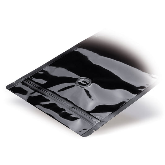 Stand-up pouch black with aroma protection valve — Detail view in a typical packaging application with content example